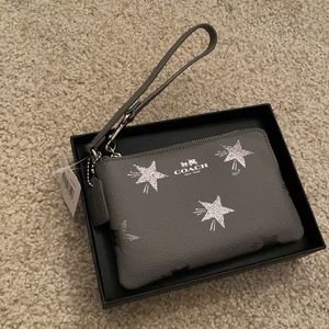 A perfect fit coach wristlet